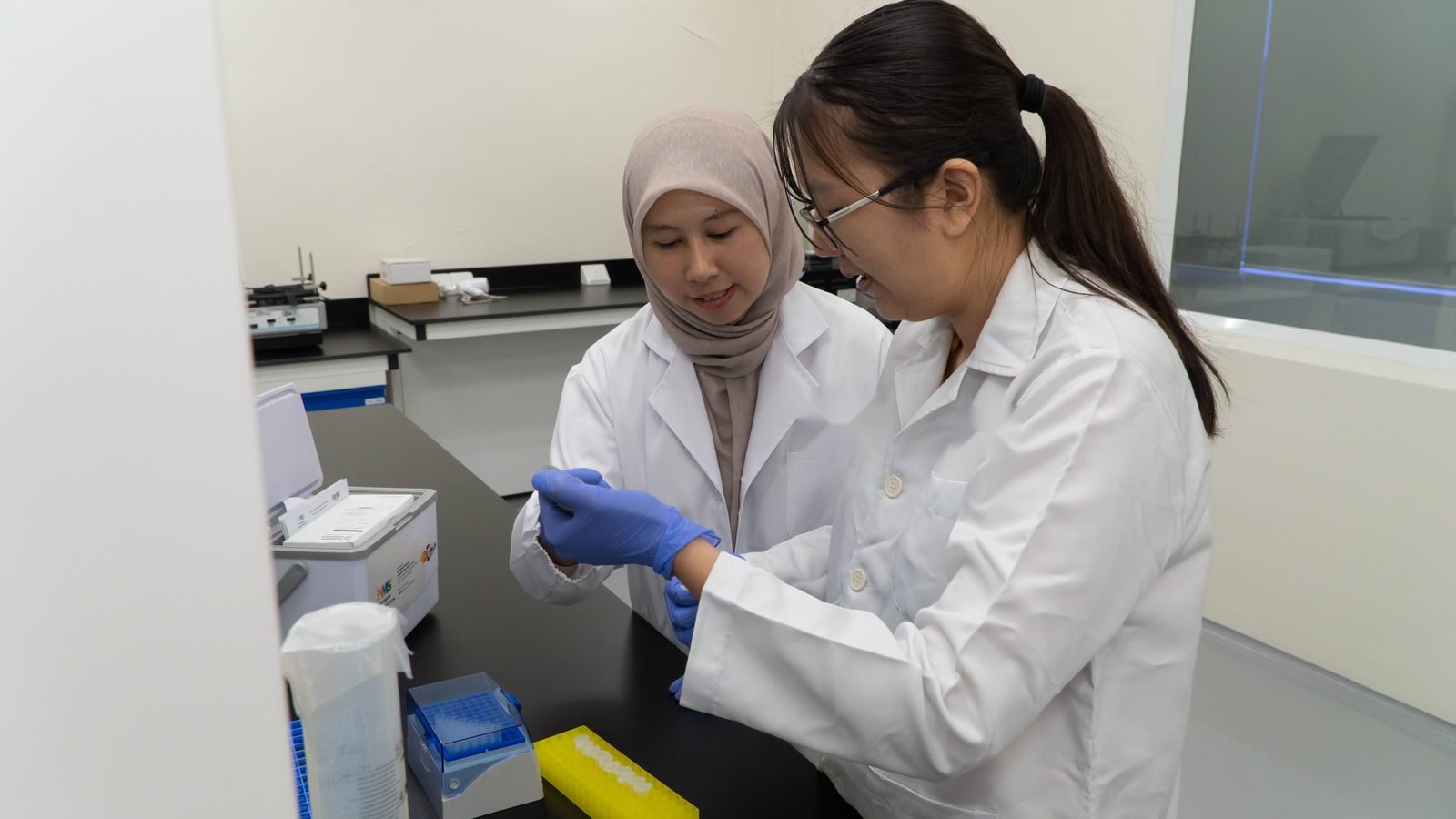 Neo Nexon scientists preparing a DNA sample in the laboratory