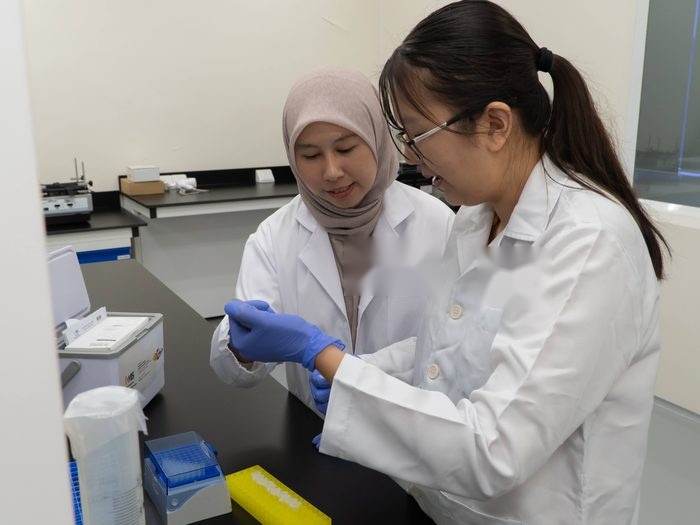 Neo Nexon scientists reviewing a sample in the laboratory