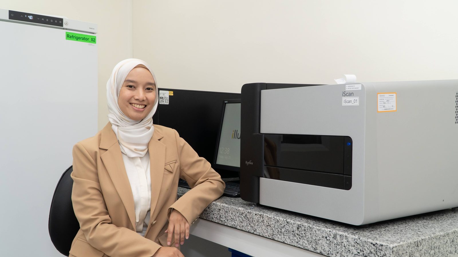 Neo Nexon scientist beside an Illumina genotyping system